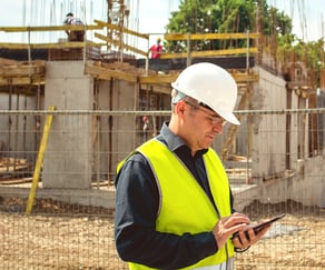 Construction project manager on cell phone