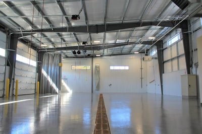 The inside of a warehouse or manufacturing facility that was designed with natural lighting for the employee's benefit and retention