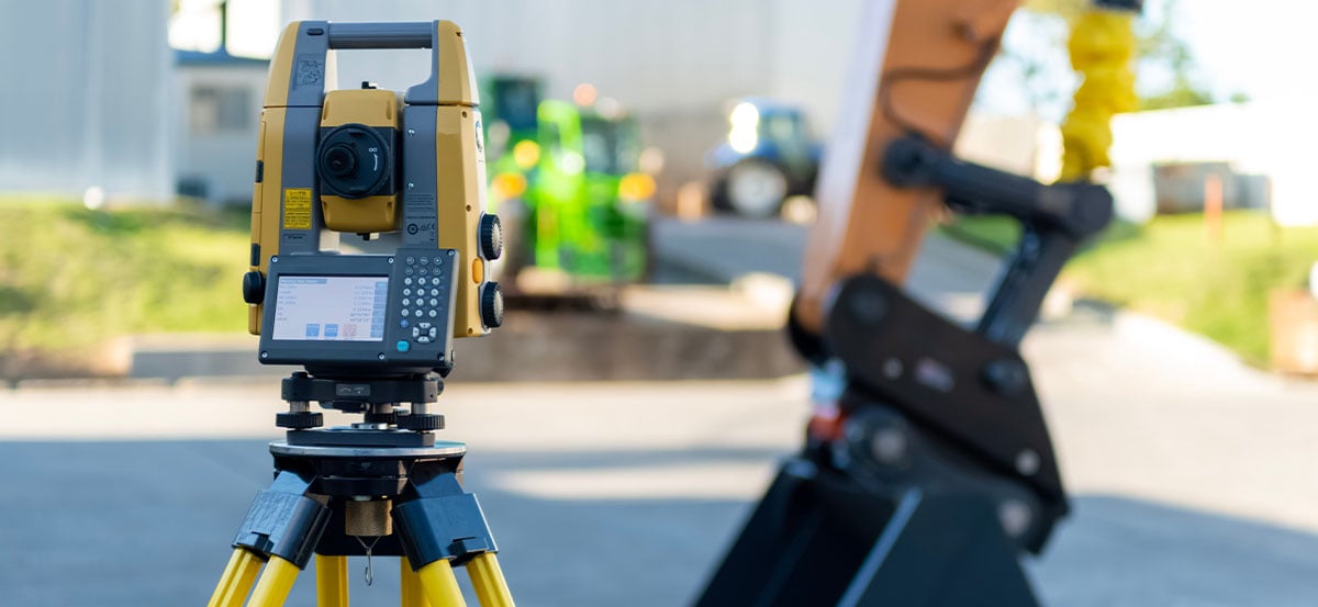 Robotic total station in action with excavator