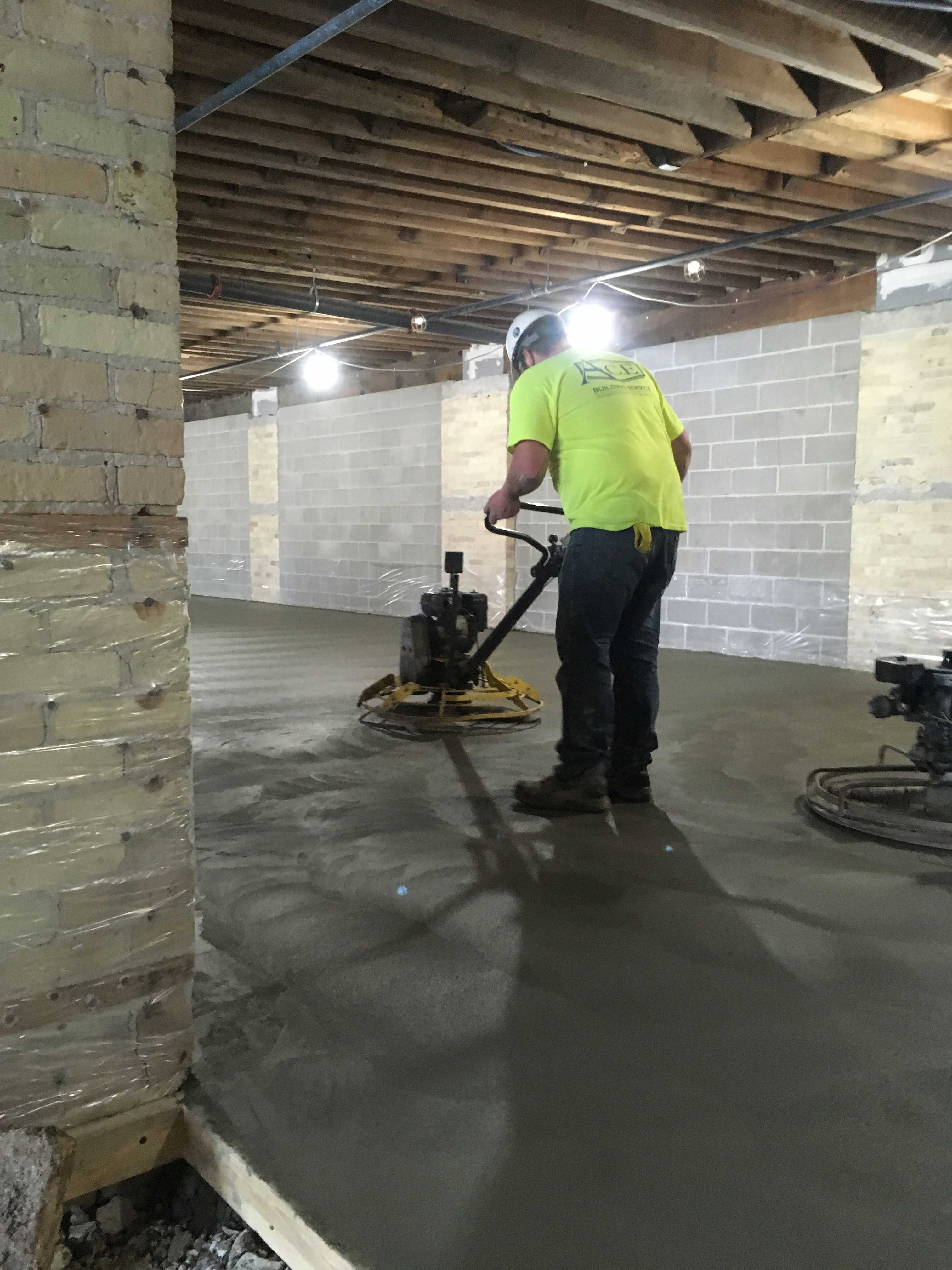 Concrete floor being installed at Manitowoc WI bar restaurant renovation.