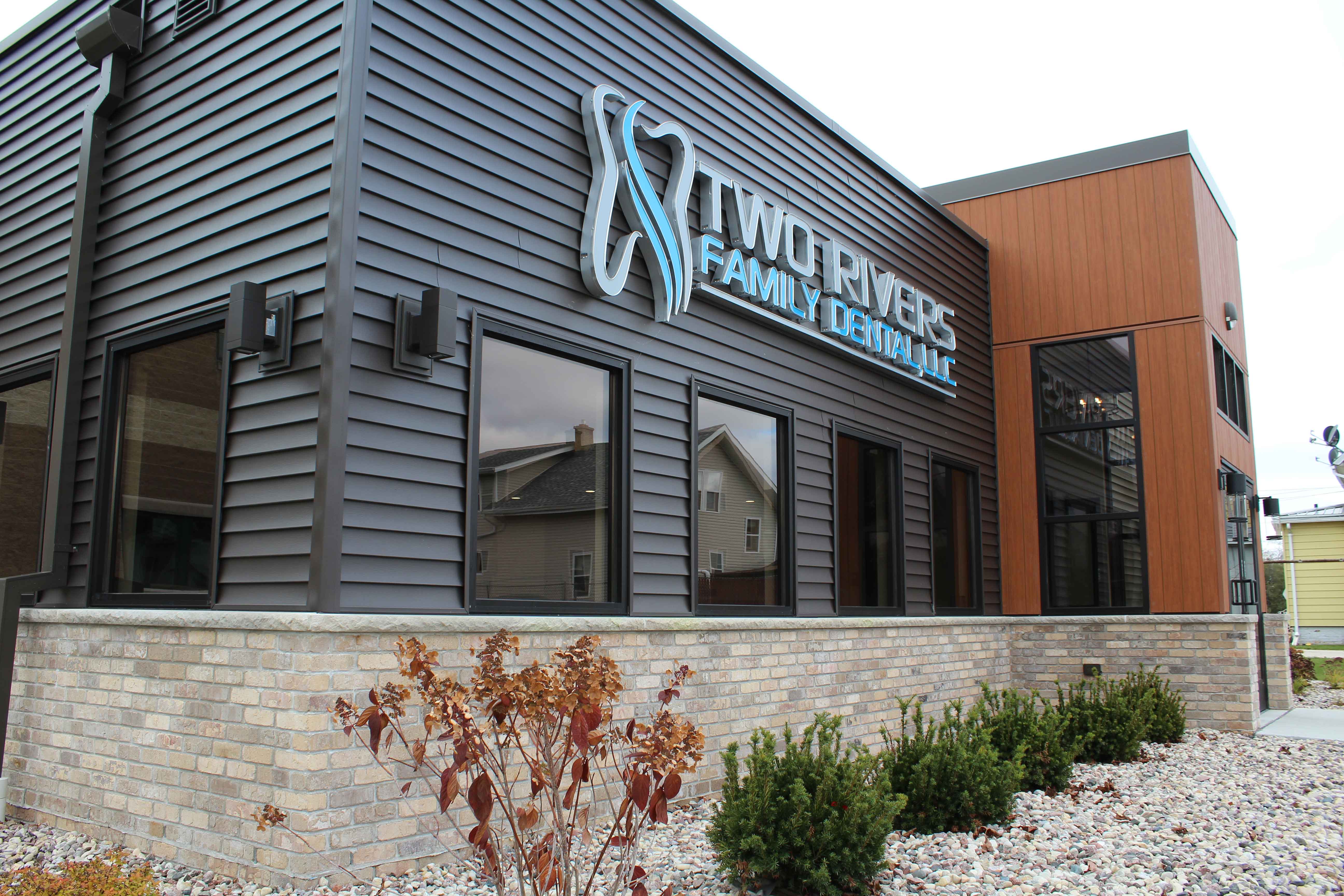 Close up of exterior sign at Two Rivers Family Dental